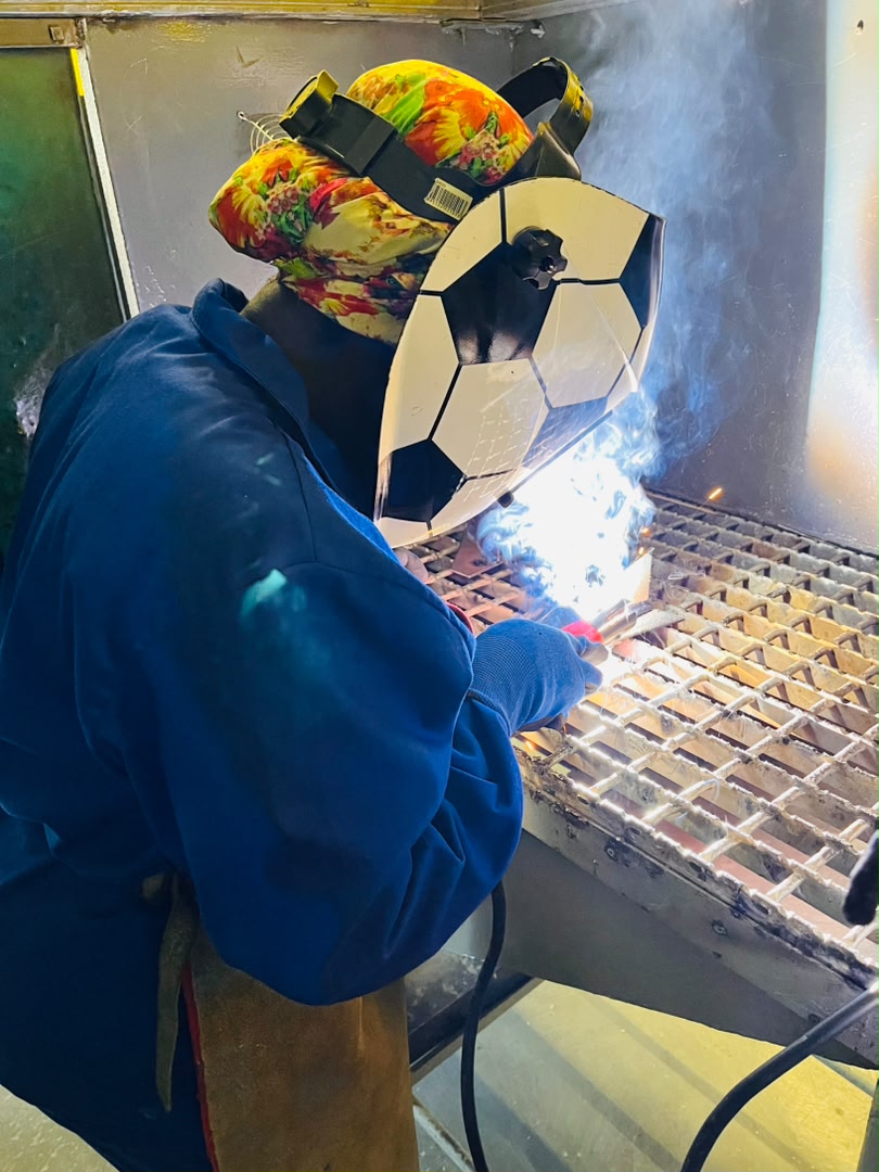 NIMT trainee using donated welding equipment