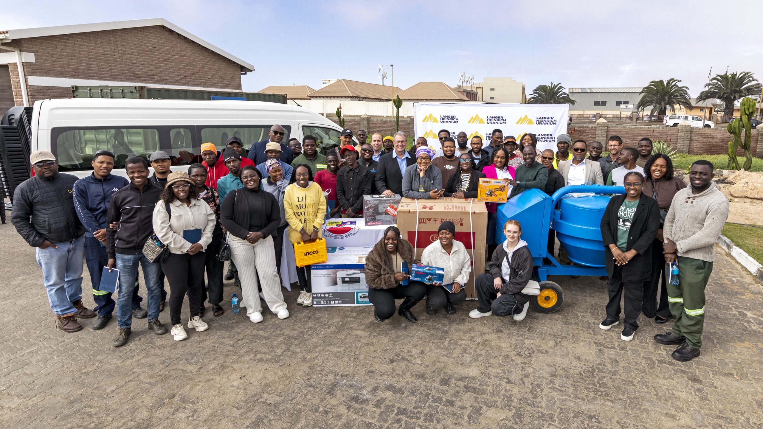 Young entrepreneurs receiving business equipment through the Youth Entrepreneurial Development Initiative