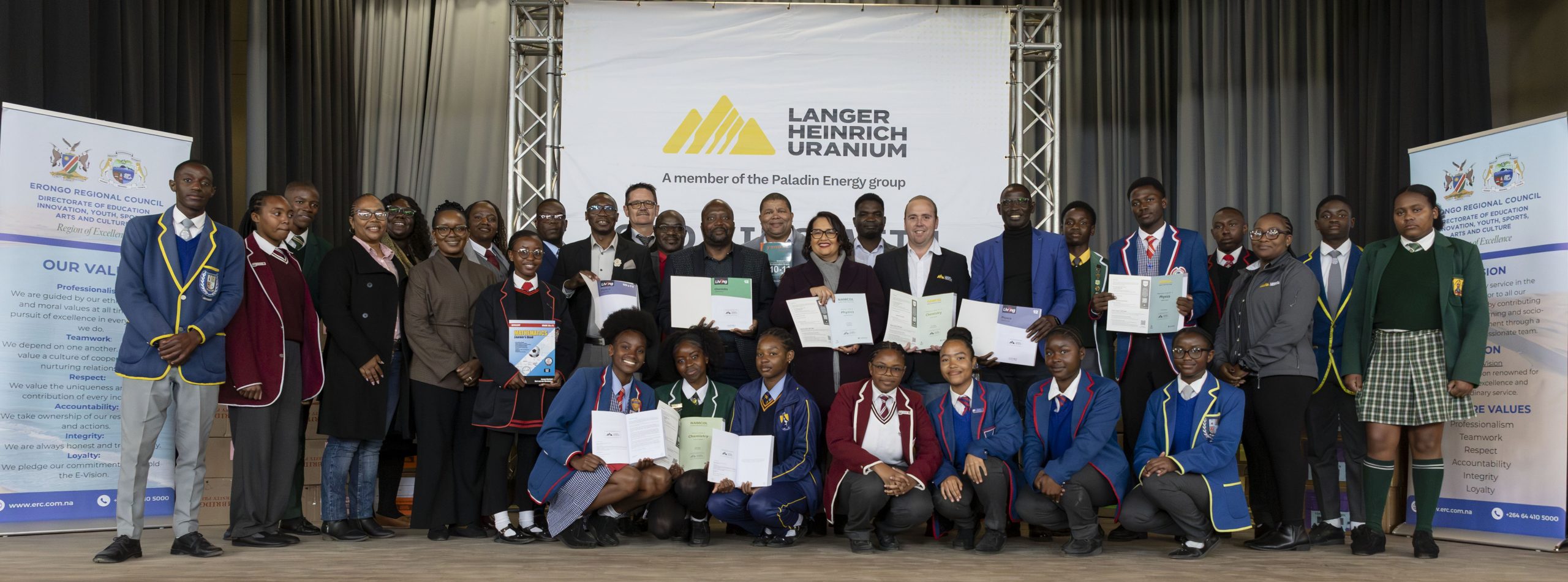 Learners receiving textbooks donated by Langer Heinrich Mine