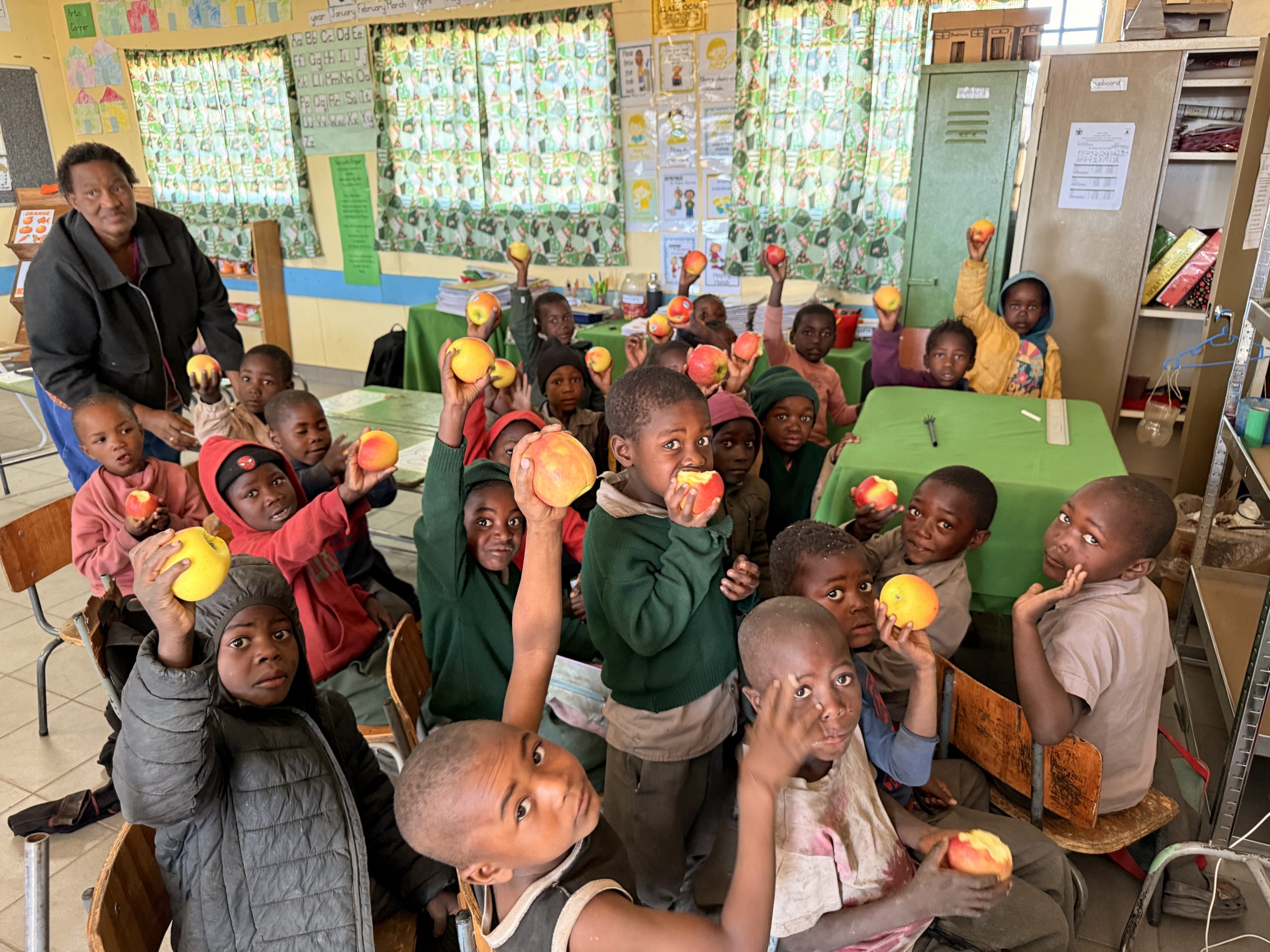 Learners receiving apples through the Cancer Association of Namibia Apple Project